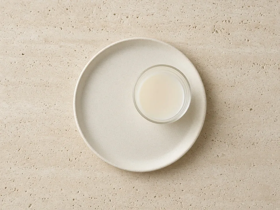 Almond milk for 12 months+: unsweetened, fortified almond drink in an open cup