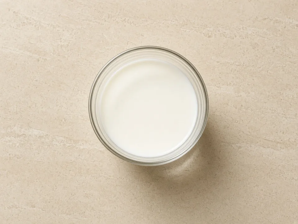 Cow's milk for 12 months+: plain whole milk in an open cup