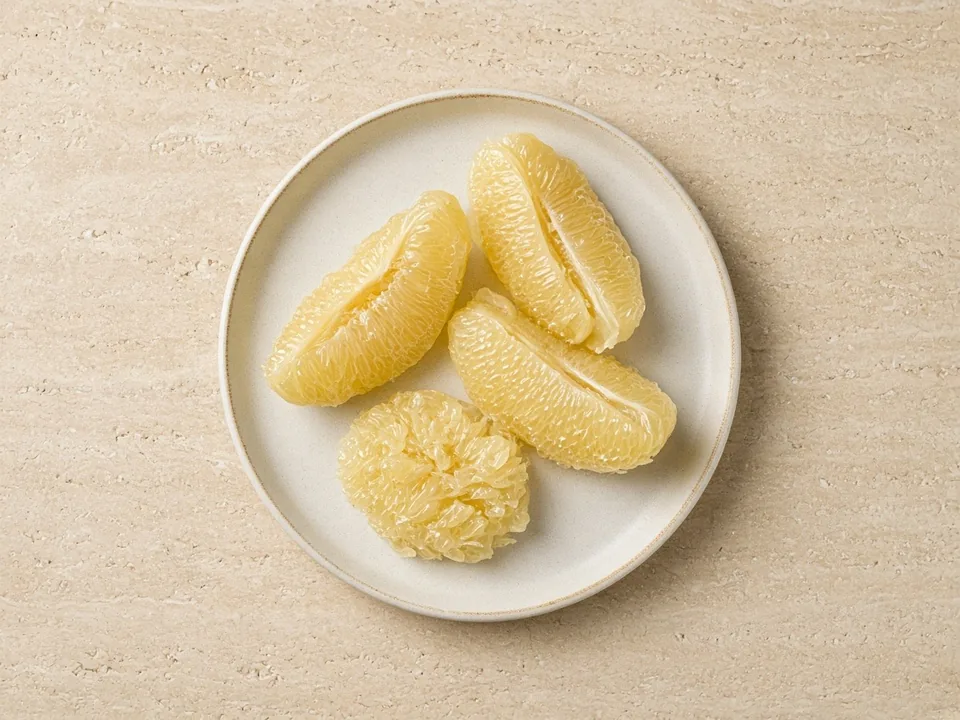Pomelo for 6 months+: large membrane-free pieces that squash easily, seeds removed