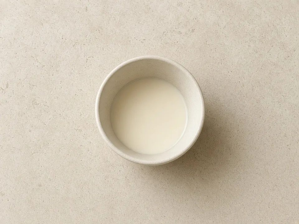 Soy milk for 12 months+: unsweetened, fortified soy drink in an open cup